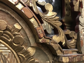 A rare Chinese gilt wood and reverse glass painted mirror, 2nd half 18th C.
