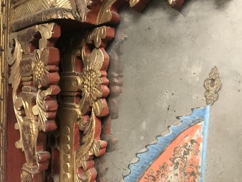 A rare Chinese gilt wood and reverse glass painted mirror, 2nd half 18th C.