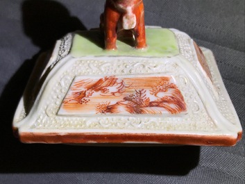 Three Chinese famille rose 'mandarin' vases and covers, Qianlong