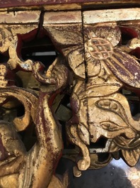 A rare Chinese gilt wood and reverse glass painted mirror, 2nd half 18th C.