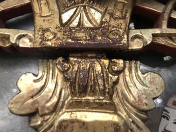 A rare Chinese gilt wood and reverse glass painted mirror, 2nd half 18th C.
