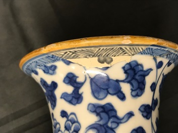 A Chinese blue and white four-piece garniture with floral design, Kangxi