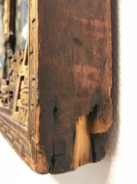 A rare Chinese gilt wood and reverse glass painted mirror, 2nd half 18th C.