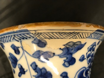 A Chinese blue and white four-piece garniture with floral design, Kangxi