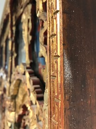 A rare Chinese gilt wood and reverse glass painted mirror, 2nd half 18th C.