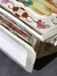 Three Chinese famille rose 'mandarin' vases and covers, Qianlong