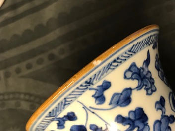 A Chinese blue and white four-piece garniture with floral design, Kangxi