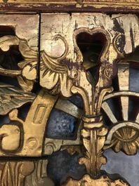 A rare Chinese gilt wood and reverse glass painted mirror, 2nd half 18th C.