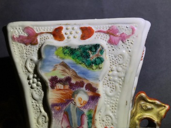 Three Chinese famille rose 'mandarin' vases and covers, Qianlong