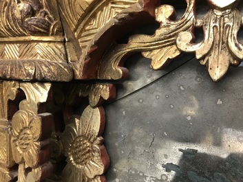 A rare Chinese gilt wood and reverse glass painted mirror, 2nd half 18th C.