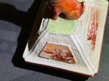 Three Chinese famille rose 'mandarin' vases and covers, Qianlong