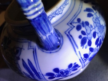 A Chinese blue and white gate-handled teapot and cover, Kangxi