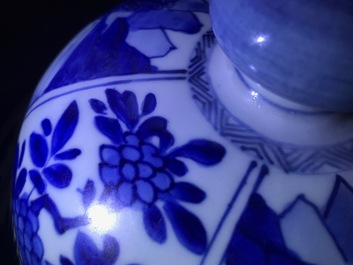 A large Chinese blue and white three-piece garniture with landscape and floral panels, Kangxi