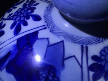 A large Chinese blue and white three-piece garniture with landscape and floral panels, Kangxi
