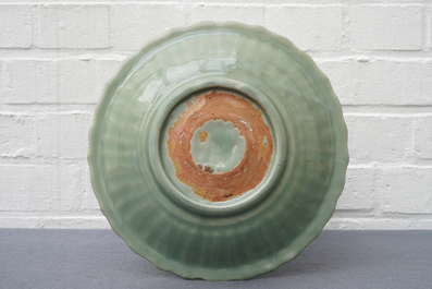 A Chinese Longquan celadon dish with underglaze design, Ming