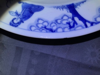 A Chinese blue and white plate with figures in a pagoda, Kangxi