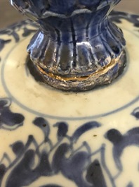 A tall Chinese blue and white 'lotus scroll' vase and cover, Kangxi