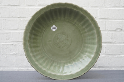 A Chinese Longquan celadon dish with underglaze design, Ming