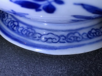 A Chinese blue and white gate-handled teapot and cover, Kangxi