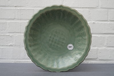 A Chinese Longquan celadon dish with underglaze design, Ming