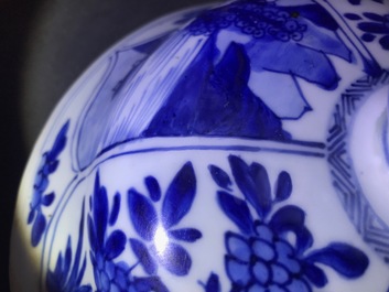 A large Chinese blue and white three-piece garniture with landscape and floral panels, Kangxi