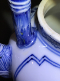 A Chinese blue and white gate-handled teapot and cover, Kangxi