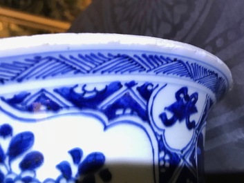 A large Chinese blue and white three-piece garniture with landscape and floral panels, Kangxi