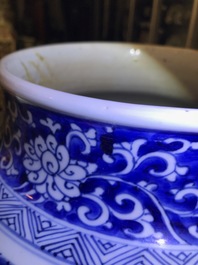 A large Chinese blue and white three-piece garniture with landscape and floral panels, Kangxi