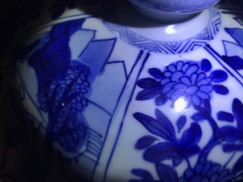 A large Chinese blue and white three-piece garniture with landscape and floral panels, Kangxi