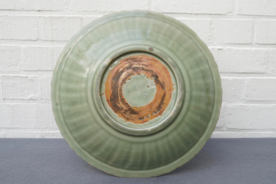 A Chinese Longquan celadon dish with underglaze design, Ming