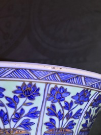 A clobbered Chinese blue and white 'gu' beaker vase, Kangxi
