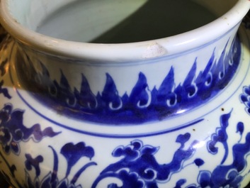 A tall Chinese blue and white 'lotus scroll' vase and cover, Kangxi