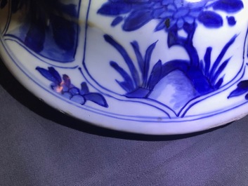 A large Chinese blue and white three-piece garniture with landscape and floral panels, Kangxi