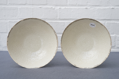 A pair of Chinese qingbai moulded 'phoenix' bowls, Song