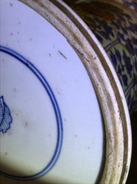 A clobbered Chinese blue and white 'gu' beaker vase, Kangxi