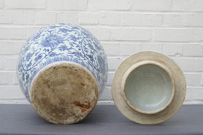 A tall Chinese blue and white 'lotus scroll' vase and cover, Kangxi