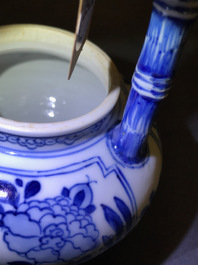 A Chinese blue and white gate-handled teapot and cover, Kangxi