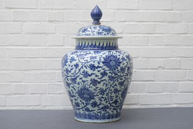 A tall Chinese blue and white 'lotus scroll' vase and cover, Kangxi