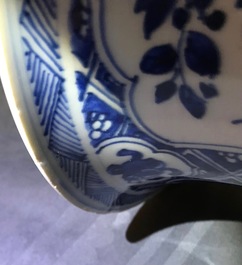 A large Chinese blue and white three-piece garniture with landscape and floral panels, Kangxi