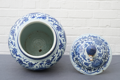 A tall Chinese blue and white 'lotus scroll' vase and cover, Kangxi