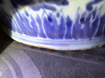 A tall Chinese blue and white 'lotus scroll' vase and cover, Kangxi
