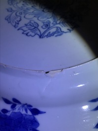 A Chinese blue and white plate with figures in a pagoda, Kangxi