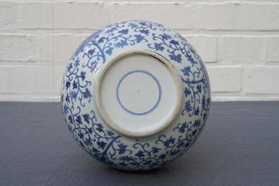 A Chinese blue and white 'lotus scroll' bottle vase, 18/19th C.