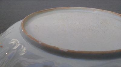 A Chinese 'milk and blood' dish, a blue and white klapmuts bowl and a tea caddy, Kangxi
