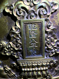A Chinese gilt bronze bell in zitan suspension frame, Qianlong mark, 18/19th C.