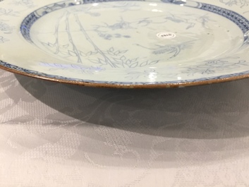 A Chinese blue and white pencil style charger with a deer and two herons, Yongzheng