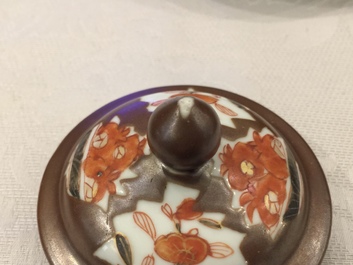 A Chinese Imari style capucin ground teapot and 17 cups and saucers, Qianlong