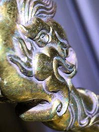 A Chinese gilt bronze bell in zitan suspension frame, Qianlong mark, 18/19th C.