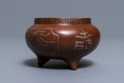 A Chinese silver-inlaid bronze incense burner, Xuande mark, 19th C.