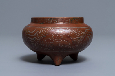 A Chinese silver-inlaid bronze incense burner, Xuande mark, 19th C.